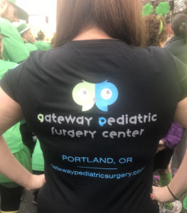 Gateway Pediatric Surgery Center staff runs in 2018 Shamrock Run in Portland, OR.